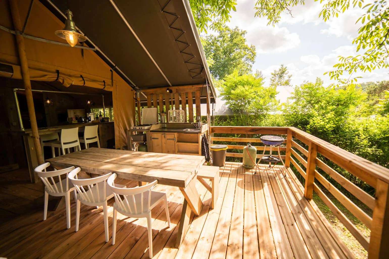 Terrace of a lodge at Camping Les 3 Cantons
